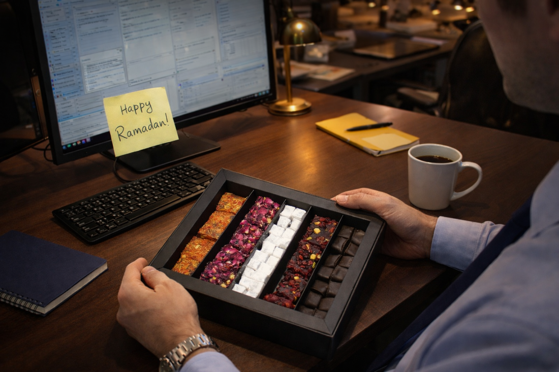 Person holding box of sweets.